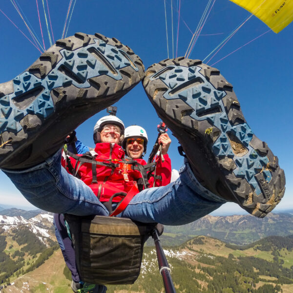 Tandem paragliding flight with a view of the Nagelfluhkette and Hörnerkette mountains